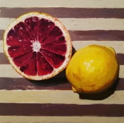 Grapefruit and Lemon on a Wooden Board